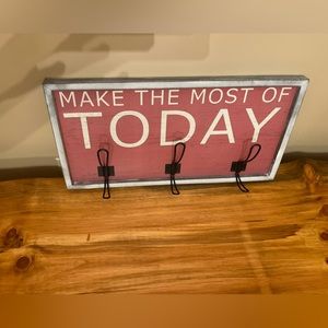 Super cute 3-hook wall mounted coat rack.